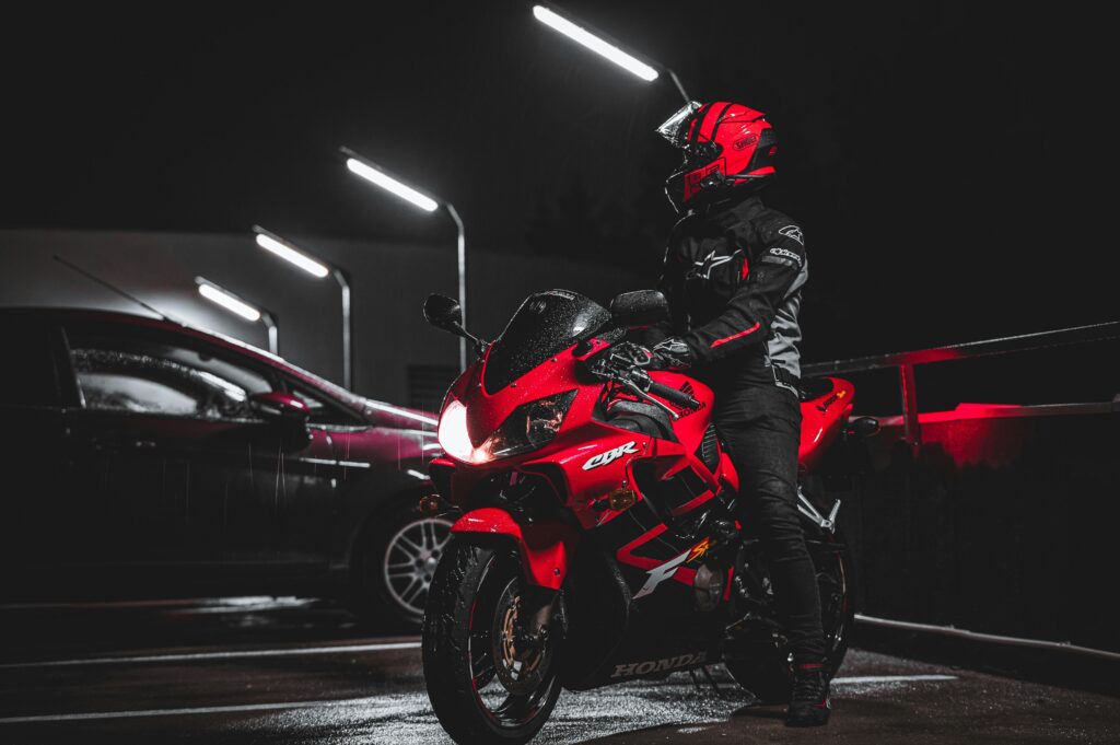 Single rider wearing helmet + gloves motoxon